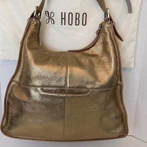 Authentic HOBO shoulder bag, gold, adjustable strap, like new, includes dust bag